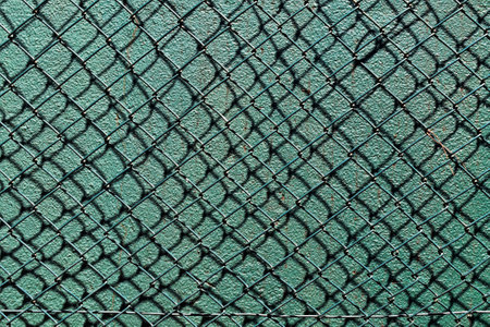 Green mesh, rhombus grid on green backgroundの写真素材