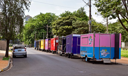 RIBEIRAO PRETO, SAO PAULO, BRAZIL - January 2, 2024: Food trucks parked on the street