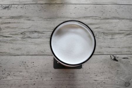 Beer on light wood table                               の写真素材