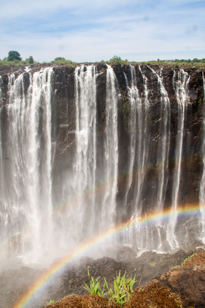 Victoria Falls with Rainbow, Zimbabweの写真素材