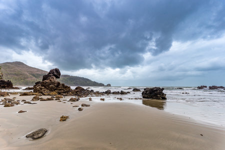 Rocks on the Beach of Cape Hillsborough during Stormy Weather, Queensland, Australia.の写真素材