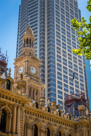 Sydney, Australia â December 26, 2021: Sydney Town Hall in front of Skyscraper.のeditorial素材