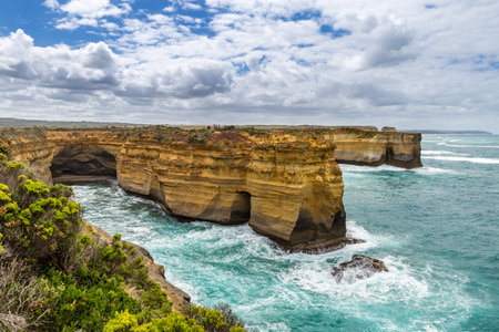 Breathtaking views of coastal cliffs and turquoise waters at Mutton Bird Island Lookout along the Great Ocean Road showcase Australia's natural beautyの写真素材