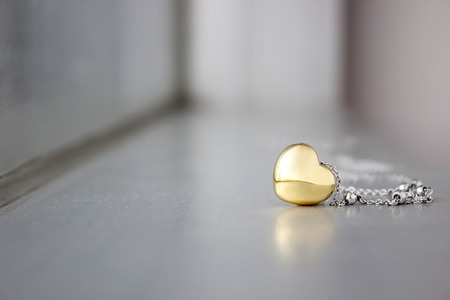 Golden heart shape connect with chain use for abstract of love sign の写真素材