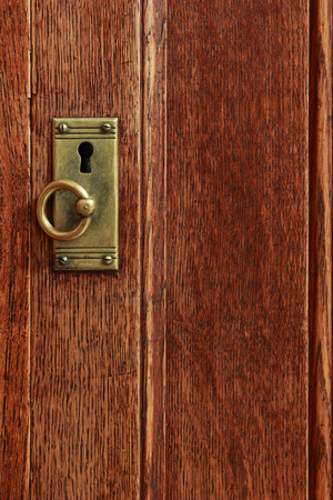 Vintage lock on wooden doorの写真素材