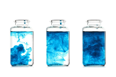 Mixing fluids in glass bottlesの写真素材