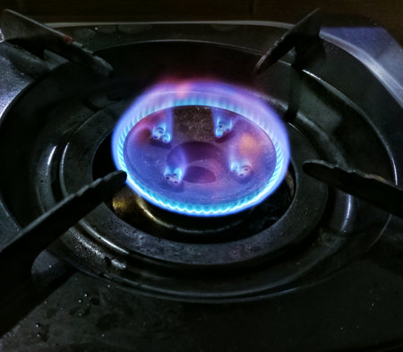 blue flame burning in the stove burnerの写真素材
