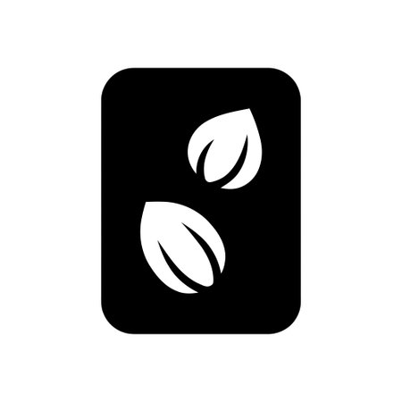 Seeds icon showing two stylized white almond shaped forms against a solid black backgroundのイラスト素材