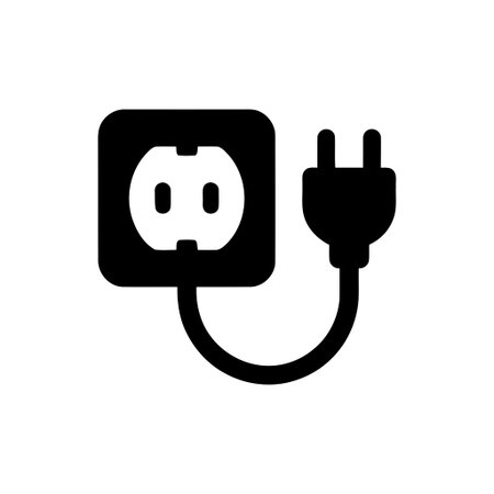Black power outlet and plug icon displayed on a clean white background symbolizing electricity...