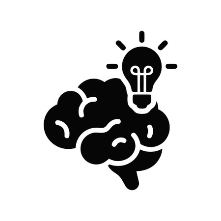 Idea illustration of a human brain with a shining light bulb symbolizing creativity and intelligenceのイラスト素材