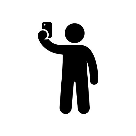 Selfie taking person holding a mobile phone up to capture a photo or video for social media
