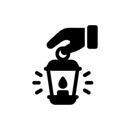 Hand holding a traditional lantern featuring a lit candle within providing warmth and gentle illuminationのイラスト素材