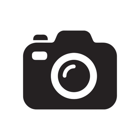Camera graphic element features a sleek simple black silhouette for use in various digital media and...