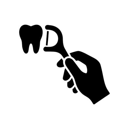 Flossing a hand holding a floss pick near a single tooth for dental hygiene and oral health careのイラスト素材
