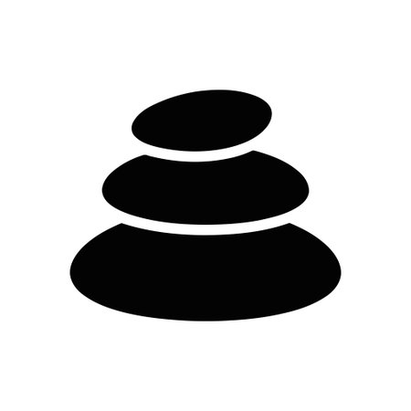 Stones stacked with careful balance symbolize tranquility and wellbeing in a serene compositionのイラスト素材