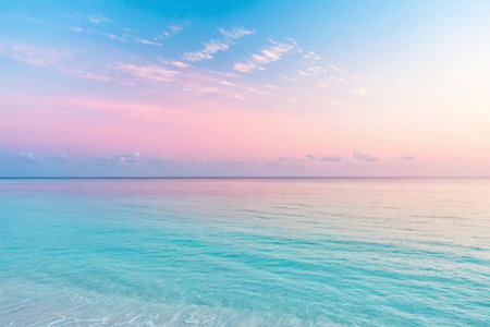 Gentle waves meet a pastel sky at dawn, creating a serene, calming seascape.の素材
