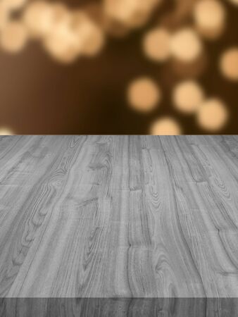 black wood table in blur light bokeh background , can used display or montage your productsの写真素材