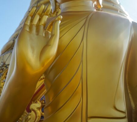 hand of golden buddha statue at Thailandの写真素材