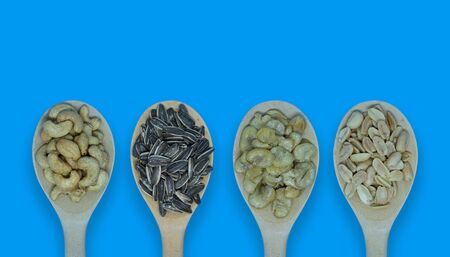 The Collection of four type nuts on wood spoon