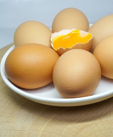 Fresh farm eggs on a wooden rustic backgroundの写真素材