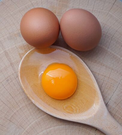 Fresh farm eggs on a wooden rustic backgroundの写真素材