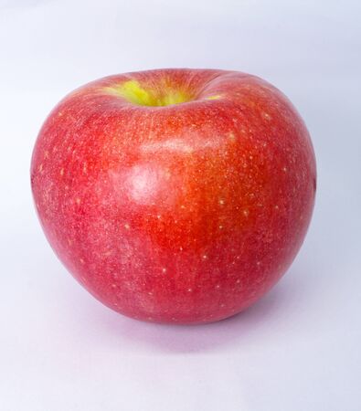 organic fresh red apple isolated on white backgroundの写真素材