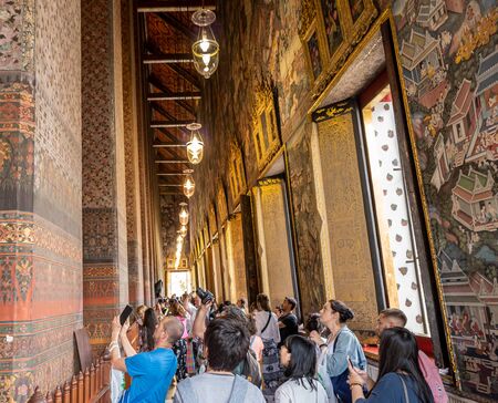 Bangkok Thailand FEB 22, 2020 : Tourists taking pictures in the church at Wat Pho Temple, Thailandのeditorial素材