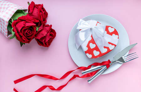 Gift or present box and red rose on pink background. for banner. The concept of Valentine Day. top...
