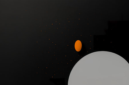 3d render of black and orange egg on black background with copy space