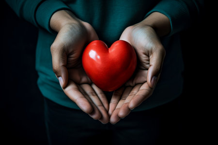 hands holding red heart, health care, love, organ donation, mindfulness, wellbeing, family insurance and CSR conceptの素材