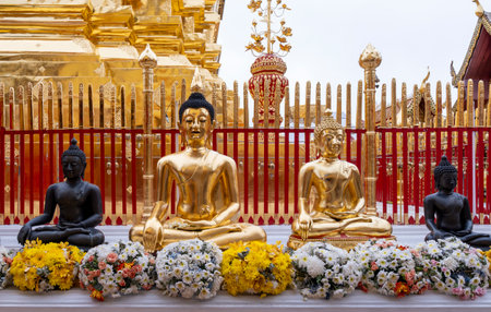Buddha at Wat Phra That Doi Suthep with golden morning sky, the most famous temple in Chiang Mai,...