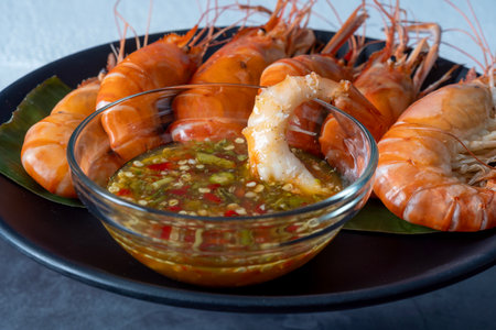 Shrimps grilled thai style, food famous in thailand, local seafood with spicy seafood sauce.の写真素材