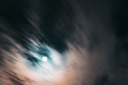 Blurred clouds in the night sky. Cloud movement in the night skyの写真素材