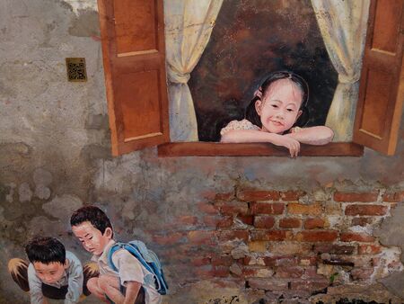 Mural street arts depicting children playing marblesのeditorial素材