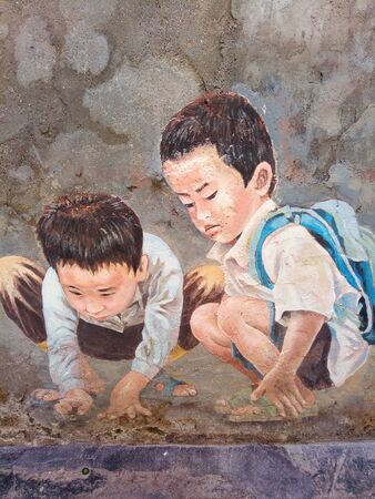 Mural street arts depicting children playing marblesのeditorial素材