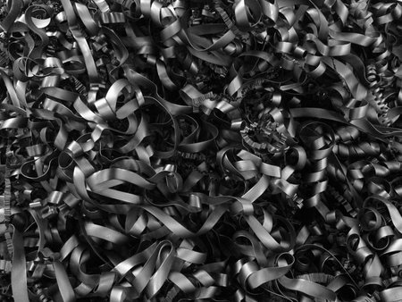 The rubber was rolled into a curly ribbon strips, Idea for background and wallpaper purposes. Abstract black and white.の写真素材