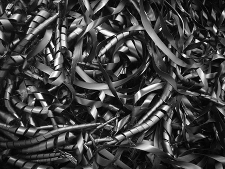 The rubber was rolled into a curly ribbon strips, Idea for background and wallpaper purposes. Abstract black and white.の写真素材