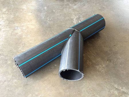HDPE Pipe Fittings Y type lay down on the concrete floor in the industrial factory.の写真素材