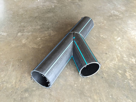 HDPE Pipe Fittings Y type lay down on the concrete floor in the industrial factory.の写真素材