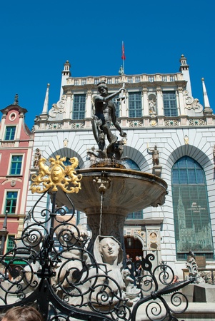 famous fountain of the Neptune against town hall in old part of Gdansk ( Poland ) 