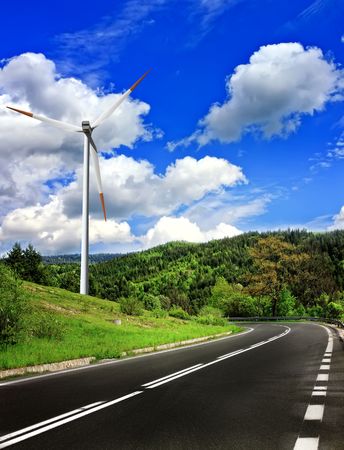 Mountain road and wind turbineの写真素材