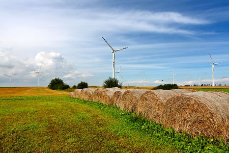 Straw bales and wind turbinesの写真素材