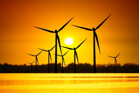 Wind turbines over sunsetの写真素材