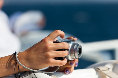 A young woman with a photo camera