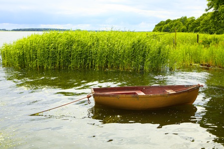 Fishing boat on the lakeの写真素材