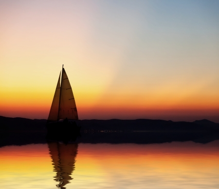 Sailboat at sunset の写真素材