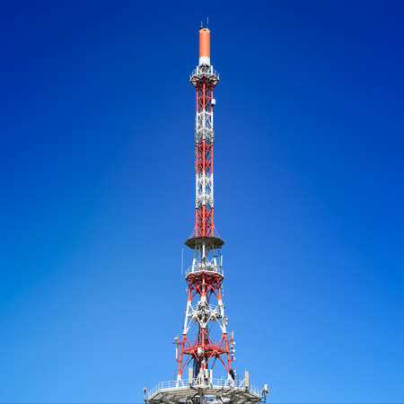 Communication tower for 4G and 5G on blue sky