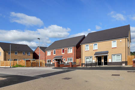 New and modern english houses on blue sky