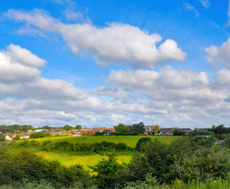 Beautiful bright colorful summer landscape with fantastic clouds in the backgroundの写真素材
