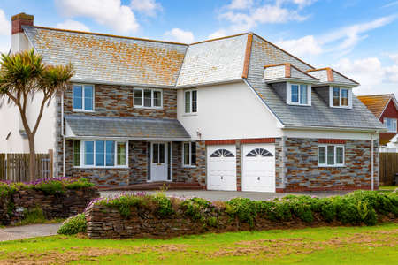 Elegant house with double garage on blue skyの写真素材